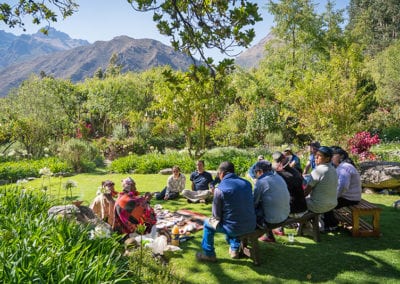 Terry and Willka Tika staff seated for Andean ritual in Chakra Gardens